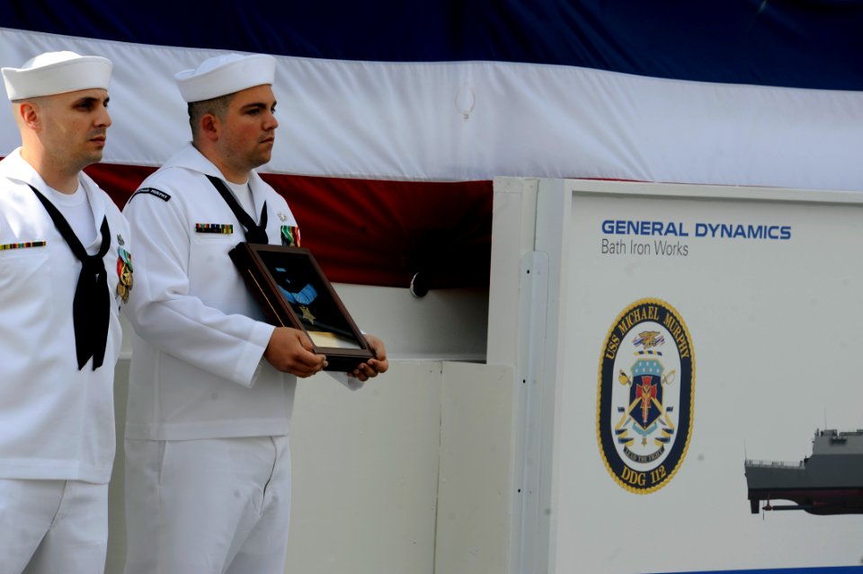 US Navy 110507-N-KK330-184 Sailors assigned to Pre-commissioning Unit (PCU) Michael Murphy (DDG 112) hold the Medal of Honor posthumously awarded t