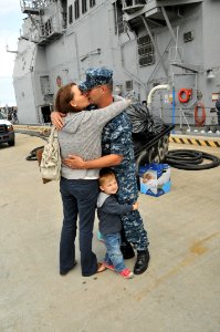 US Navy 110511-N-QY430-031 Sonar Technician (Surface) 2nd Class Roland Swain, assigned to the guided-missile cruiser USS Anzio (CG 68), kisses his photo