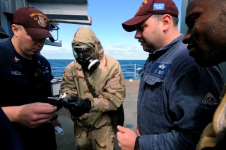 US Navy 110508-N-AE328-020 Damage Controllman 2nd Class Aaron Shields, left, and Engineman 1st Class Brian Rose, second from right, conduct trainin