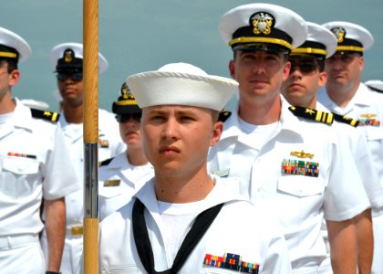 US Navy 110511-N-VA590-305 Seaman Nicholas Killion tands as guide-on bearer for the U.S. Navy company participating in the opening ceremony of CARA photo