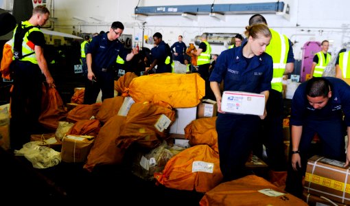 US Navy 110513-N-OK922-521 Sailors sort mail in the hangar bay of the aircraft carrier USS Carl Vinson (CVN 70) during a replenishment at sea