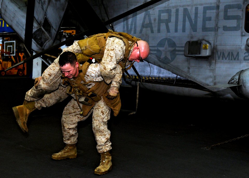 US Navy 110507-N-3154P-045 Marines perform physical tasks similar to those encountered in a combat environment during a fire team competition aboar