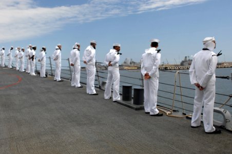 US Navy 110511-N-XQ375-182 Sailors aboard the guided-missile destroyer USS Mitscher (DDG 57) man the rails as the ship departs homeport for a sched photo