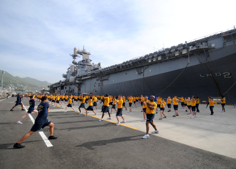 US Navy 110513-N-SO729-282 Sailors assigned to the forward-deployed amphibious assault ship USS Essex (LHD 2) participate in command physical train