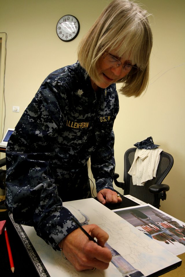 US Navy 110511-N-ZZ000-001 Cmdr. Monica Allen, a Navy combat artist specializing in watercolor, works on a new painting while deployed to Naval Air