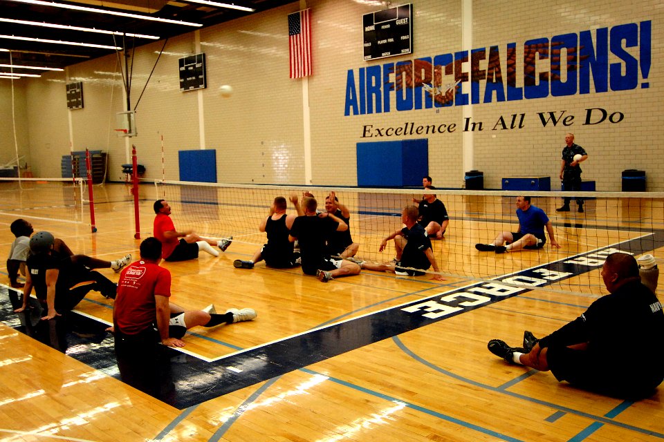 US Navy 110510-N-CD297-052 Members of the Navy-Coast Guard Warrior Games sitting volleyball team enhance their skills and develop team strategies d