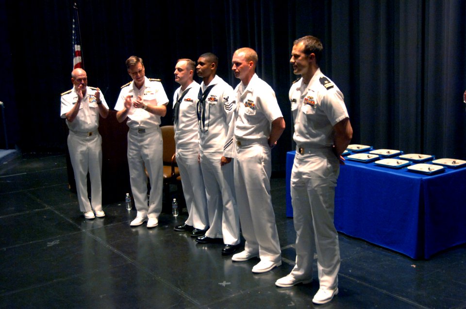 US Navy 110512-N-QP955-030 Rear Adm. Joseph Kilkenny, left, and Vice Adm. Mark E. Ferguson, III applaud NETC's Military Instructors of the Year
