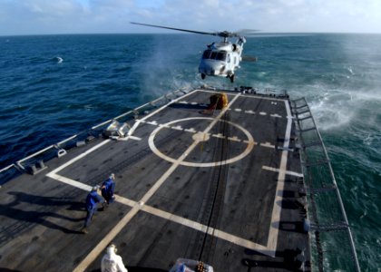 US Navy 110510-N-ZI300-141 Sailors aboard the guided-missile frigate USS Boone (FFG 28) prepare to attach a pallet of supplies to an SH-60B Sea Haw photo