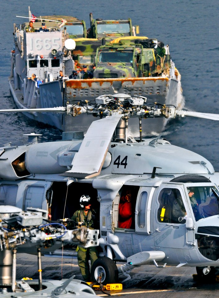 US Navy 110509-N-KB563-001 Landing Craft Utility (LCU) 1665 approaches the well deck of USS Cleveland (LPD 7) as Naval Air Crewman 1st Class Derik