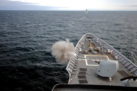 US Navy 110509-N-AE328-133 The guided-missile cruiser USS Lake Erie (CG 70) fires its 5-inch-54 caliber Mark 45 lightweight gun during a live-fire