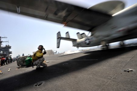 US Navy 110514-N-0569K-007 A shooter aboard the aircraft carrier USS Enterprise (CVN 65) launches an E-2C Hawkeye assigned to the Screwtops of Carr