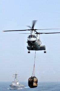 US Navy 110514-N-GW695-080 A CH-46E Sea Knight helicopter assigned to the Evil Eyes of Marine Medium Helicopter Squadron (HMM) 163, transfers suppl