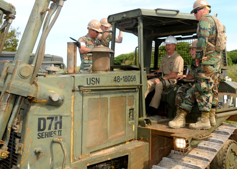 US Navy 110512-N-AW868-312 Master Chief Petty Officer of the Navy (MCPON) Rick West learns the operating controls of a D7 bulldozer while visiting
