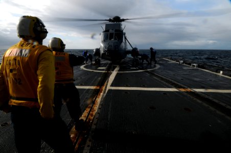 US Navy 110512-N-AE328-030 Boatswain's Mate Seaman Nash Stegall, from Fort Mill, S.C., acts as the landing signalman enlisted aboard the guided-mis