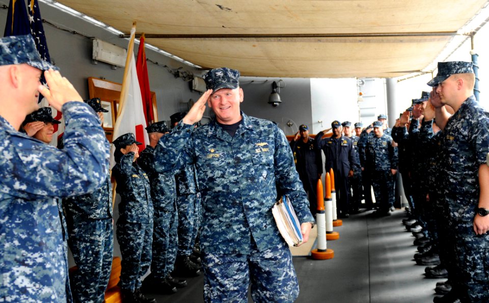 US Navy 110511-N-DB801-165 Capt. Rudy Lupton receives sideboys as he departs the U.S. 7th Fleet command ship USS Blue Ridge (LCC 19) after a change