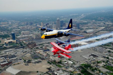 US Navy 110512-N-IR859-119 Members from the Blue Angels pilots Fat Albert in formation over Indianapolis with two Red Eagle Air Sports pilots