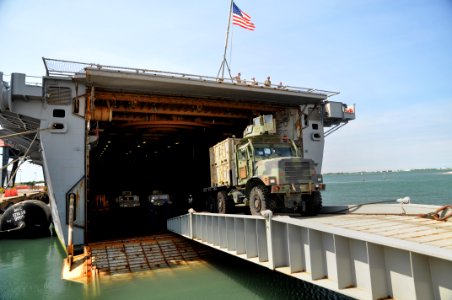US Navy 110512-N-7293M-383 A 7-ton truck assigned to the 26th Marine Expeditionary Unit (26th MEU) departs the amphibious transport dock USS Ponce