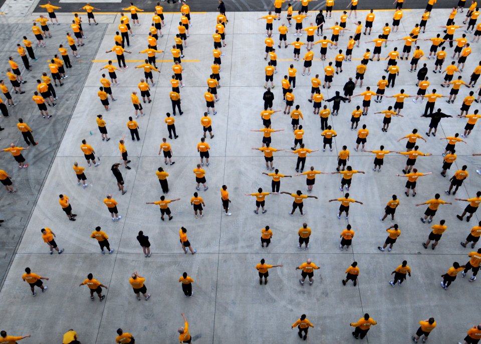 US Navy 110513-N-SO729-354 Sailors assigned to the forward-deployed amphibious assault ship USS Essex (LHD 2) participate in command physical train