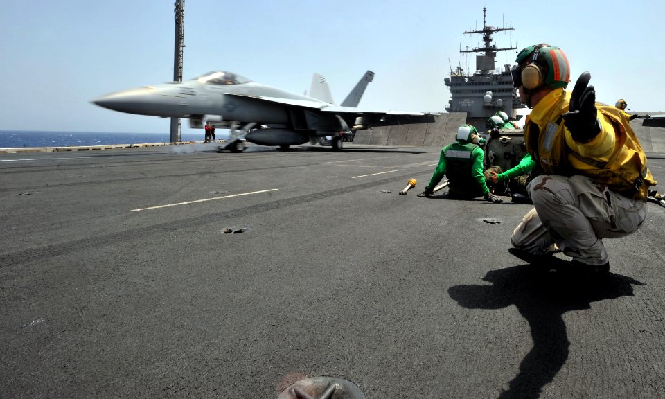 US Navy 110514-N-0569K-004 A shooter aboard the aircraft carrier USS Enterprise (CVN 65) launches an F-A-18E Super Hornet assigned to the Knighthaw