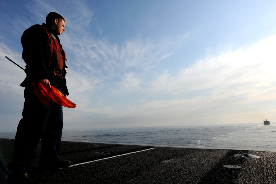 US Navy 110513-N-XE109-051 Quartermaster 3rd Class Bradley Barber watches as his watches as the ship approaches the Military Sealift Command fast c