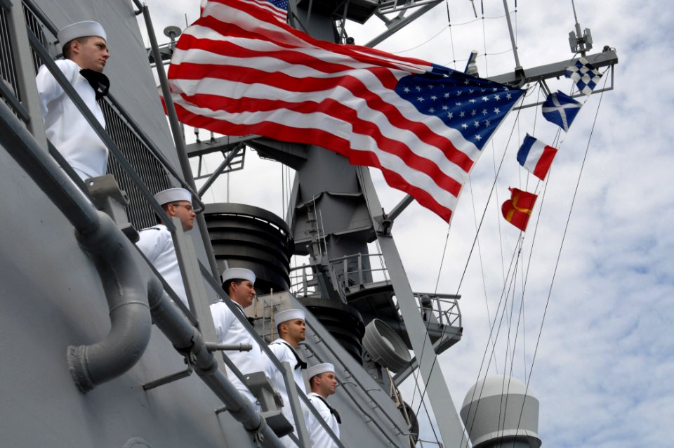 US Navy 110511-N-XQ375-313 Sailors aboard the guided-missile destroyer USS Mitscher (DDG 57) man the rails as the ship departs homeport for a sched