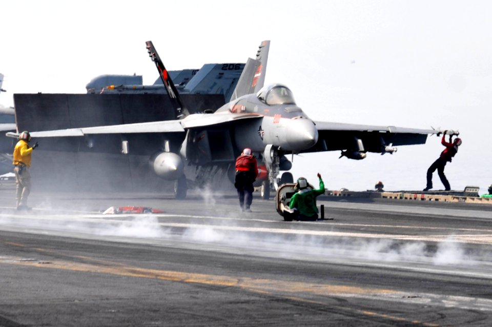 US Navy 110516-N-GL340-378 Sailors prepare an F-A-18E Super Hornet assigned to the Argonauts of Strike Fighter Squadron (VFA) 147 to catapult from