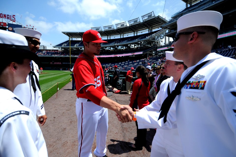 US Navy 110515-N-AD372-105 Washington Nationals pitcher Cole Kimball takes a moment to congratulate the 2010 Sailors of the Year before being honor