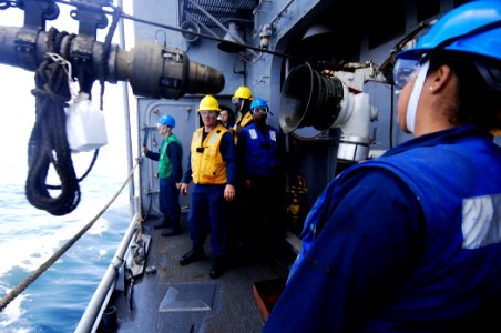 US Navy 110514-N-DU438-311 Sailors aboard the guided-missile cruiser USS Gettysburg (CG 64) stand by as a fueling hose is detached during a repleni