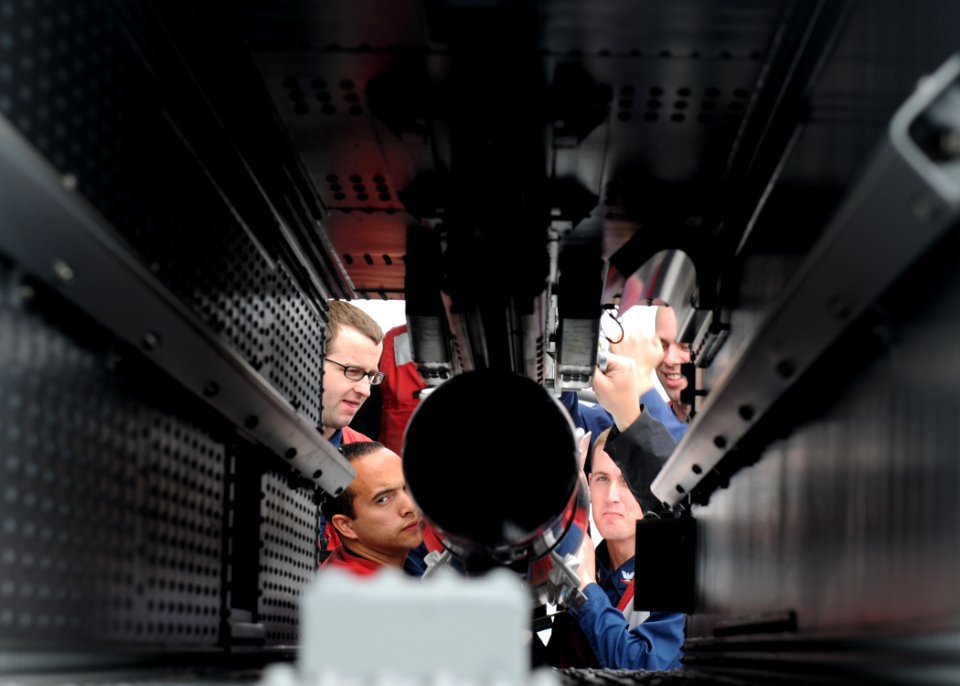 US Navy 110515-N-QL471-104 Sailors load a NATO Sea Sparrow missile into one of the ship's launchers aboard USS George H.W. Bush (CVN 77)