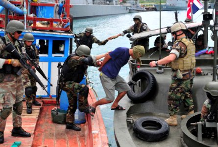 US Navy 110514-N-XR557-103 Chief Boatswain's Mate Steven Sturm, right, from Riverine Squadron (RIVRON) 1, observes as members of the Royal Thai Nav