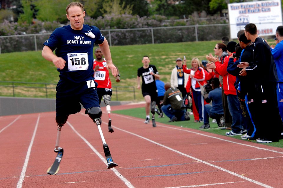 US Navy 110517-N-CD297-015 Team Navy-Coast Guard member Lt. Daniel B. Cnossen runs the 800-meter during the second annual Warrior Games