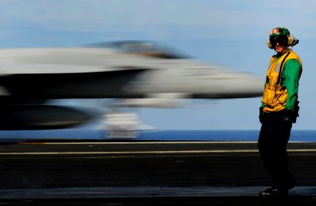 US Navy 110513-N-GZ277-160 Aviation Boatswain's Mate (Equipment) 2nd Class Timothy Knott supervises the launching of aircraft on the flight deck