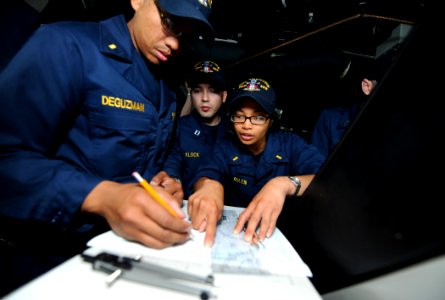 US Navy 110515-N-TB177-354 Sailors plot ship positions on a maneuvering board on the bridge of the guided-missile destroyer USS Truxtun (DDG 103) d photo
