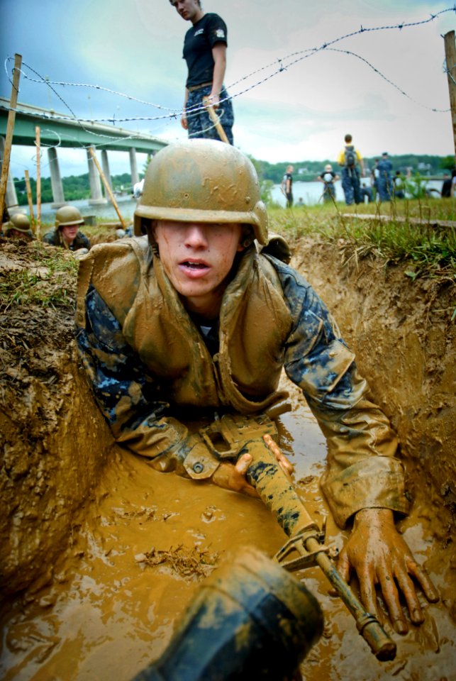 US Navy 110517-N-OA833-003 A U.S. Naval Academy plebe navigates the low crawl obstacle during Sea Trials, the capstone training exercise for Naval