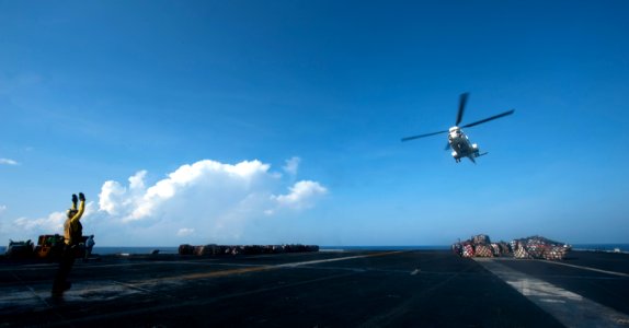 US Navy 110513-N-TU221-373 An aircraft director signals to a Puma helicopter