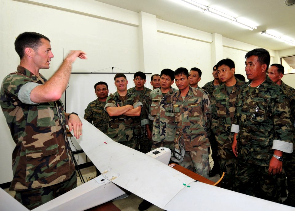 US Navy 110513-N-XR557-166 Lt. Nels Peterson, future operations officer of Riverine Squadron (RIVRON) 1, explains the capabilities of the Aqua Puma