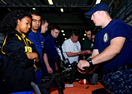 US Navy 110515-N-3154P-247 Sailors and civilians embarked for a Tiger Cruise learn about weapons and weapon safety from fire controlmen aboard USS