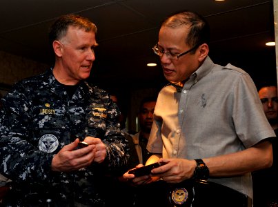 US Navy 110514-N-DR144-854 Capt. Bruce H. Lindsey, commanding officer of the aircraft carrier USS Carl Vinson (CVN 70), presents a command coin to