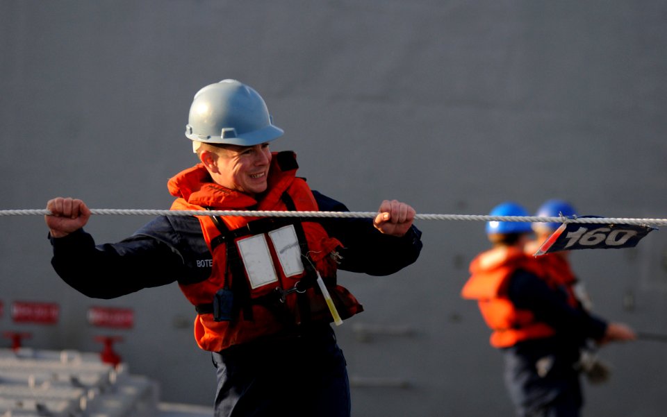 US Navy 110518-N-AQ172-341 Electronics Technician 3rd Class Jason Botelho mans the phone and distance line aboard the Ticonderoga-class guided-miss
