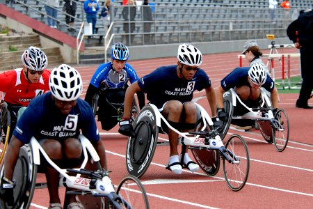 US Navy 110517-N-CD297-007 Team Navy-Coast Guard member Hospital Corpsman 3rd Class Angelo Anderson participates in the 200-meter wheelchair event