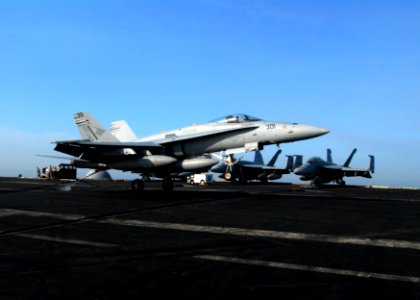 US Navy 110518-N-SB672-163 An F-A-18C Hornet assigned to the Blue Diamonds of Strike Fighter Squadron (VFA) 146 makes an arrested landing on the fl
