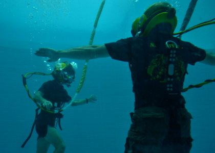 US Navy 110517-N-VA590-123 Navy Diver 1st Class Dale Park, right, and Navy Diver 2nd Class Dietrich Zacher, both assigned to Southwest Regional Mai