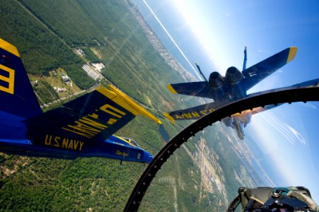 US Navy 110517-N-BA418-005 Pilots assigned to the U.S. Navy flight demonstration squadron, the Blue Angels, fly F-A-18 Hornet strike fighters over photo