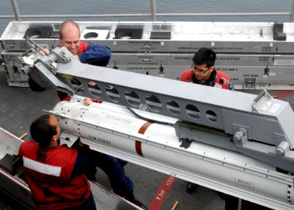 US Navy 110515-N-QL471-114 Sailors load a NATO Sea Sparrow missile into one of the ship's launchers aboard USS George H.W. Bush (CVN 77)