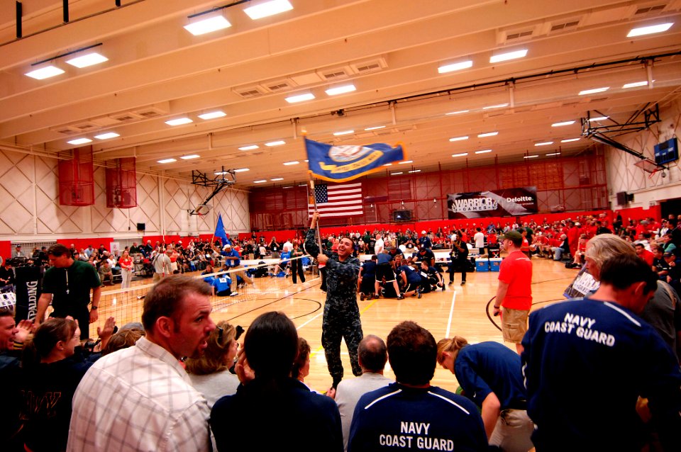 US Navy 110518-N-CD297-126 A Sailor leads cheers as Team Navy-Coast Guard prepares to play the Air Force in a preliminary game of sitting volleybal