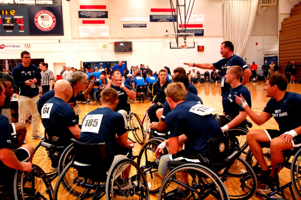 US Navy 110517-N-CD297-099 Members of Team Navy-Coast Guard huddle as they plan a strategy against the U.S. Air Force in a preliminary wheelchair b