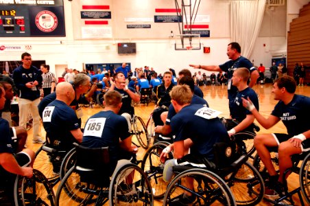 US Navy 110517-N-CD297-099 Members of Team Navy-Coast Guard huddle as they plan a strategy against the U.S. Air Force in a preliminary wheelchair b