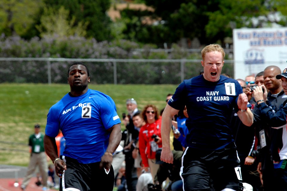 US Navy 110517-N-CD297-065 Team Navy-Coast Guard member Lt. John Edmonston, right, runs in the 100-meters finals during the second annual Warrior G