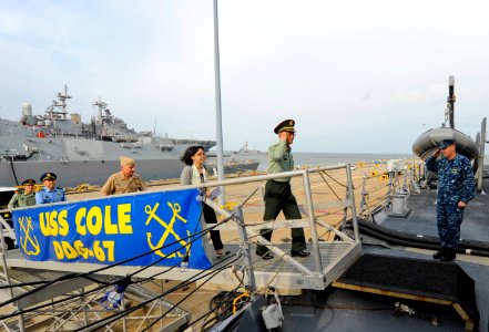 US Navy 110519-N-CI175-058 Cmdr. Pete Nilsen welcomes aboard visitors from the Republic of China People's Liberation Army for a tour of USS Cole (D