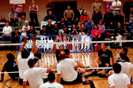 US Navy 110518-N-CD297-256 Team Navy-Coast Guard plays Special Operations Command in a preliminary game of sitting volleyball during the second ann